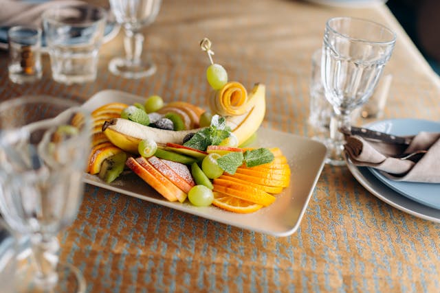 A budget-friendly assortment of fresh fruits and vegetables beautifully arranged on a table